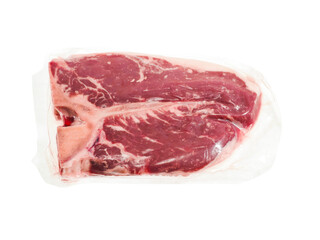 Expensive T bone steak in vacuum packaging on white background. Luxurious premium beef meat product. Butcher craft.