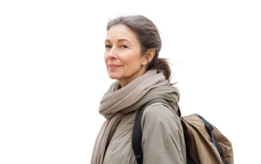 Woman wearing a gray jacket and a scarf is smiling and holding a backpack