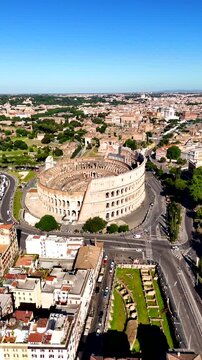 Roman Colosseum drone view. Flavius Amphitheater is an architectural monument of Ancient Rome, an aerial view. Rome, Itally. Vertical video
