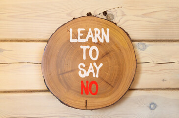 Learn to say no symbol. Concept words phrase Learn to say no on beautiful wooden circle. Beautiful...