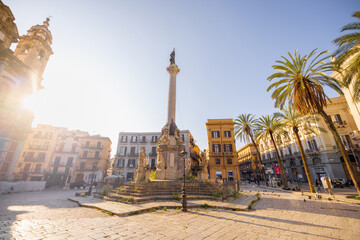 Early morning sun illuminates the column and baroque sculptures at Piazza San Domenico in Palermo, Sicily. This image captures timeless European charm, ideal for travel, history, and architecture