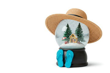 A snow globe in a hat and flip-flops nearby, like a tourist. Space for text.