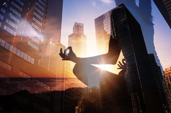 Work life balance. Woman meditating in a busy city work environment. Stress control, Psychology freedom, power of mind concept 