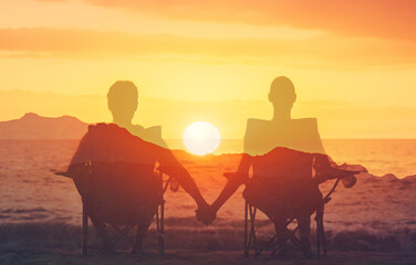 Young couple enjoying sunset together outdoors enjoys life and summer holiday, nature, happiness