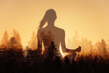 Just breath! Young woman in a calm state of mind meditating in peaceful forest nature sunrise 