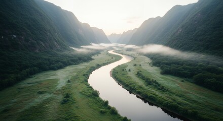 River Flowing Through Valley Landscape at Sunrise
