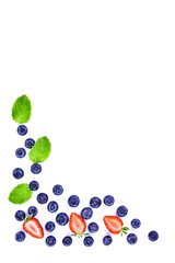Fresh blueberries, strawberries and mint leaves on white background. Healthy summer fruits and berries. Minimal design with copy space.