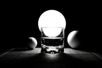 Composition with a glass with a water	