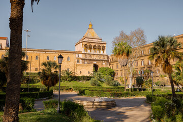 Obraz premium A majestic view of Porta Nuova in Palermo, Sicily, where Renaissance architecture meets golden afternoon light. The historic gate frames the path to Palermos royal past