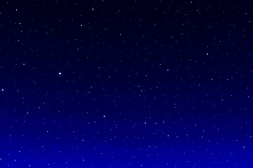 Dark blue galaxy space background. Starry night sky. Glowing stars in space.