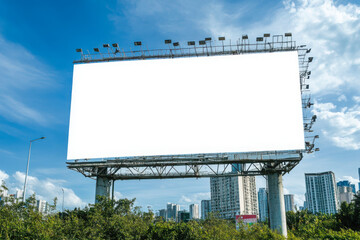 Fototapeta premium Blank billboard against a cloudy blue sky