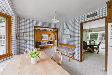 Vintage Mid-Century Home Interiors with Wood Paneling, Built-Ins, and Natural Light