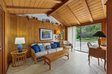 Vintage Mid-Century Home Interiors with Wood Paneling, Built-Ins, and Natural Light