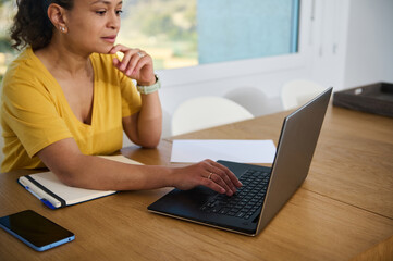 Woman Working Remotely at Home Office in a Relaxed Setting