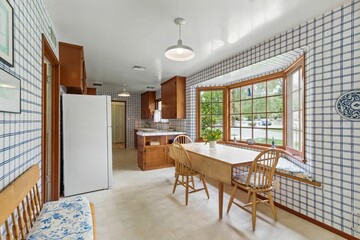 Vintage Mid-Century Home Interiors with Wood Paneling, Built-Ins, and Natural Light