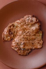 Steak, grilled beef, sirloin cooked on the barbecue with salt and spices