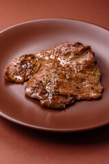 Steak, grilled beef, sirloin cooked on the barbecue with salt and spices