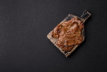 Steak, grilled beef, sirloin cooked on the barbecue with salt and spices