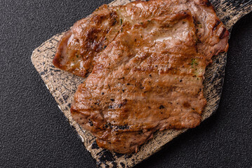 Steak, grilled beef, sirloin cooked on the barbecue with salt and spices
