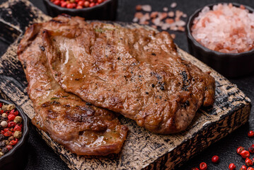 Steak, grilled beef, sirloin cooked on the barbecue with salt and spices