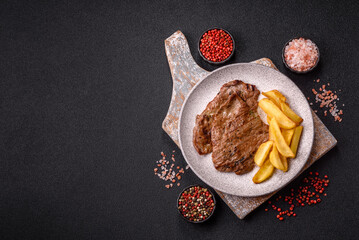 Steak, grilled beef, sirloin cooked on the barbecue with salt and spices