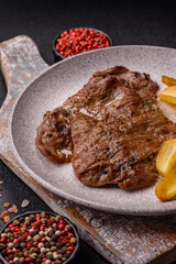 Steak, grilled beef, sirloin cooked on the barbecue with salt and spices