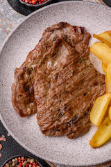 Steak, grilled beef, sirloin cooked on the barbecue with salt and spices