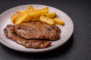 Steak, grilled beef, sirloin cooked on the barbecue with salt and spices