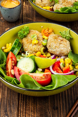 Lunch bowl of fish cutlets.