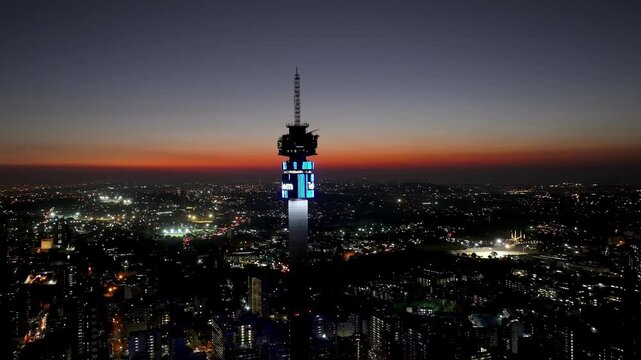 Sunset Telkom Antenna In Johannesburg Gauteng South Africa. High Rise Building And Busy Traffic In Downtown Cityscape. Building Infrastructure Landscape High Rise Building Busy.