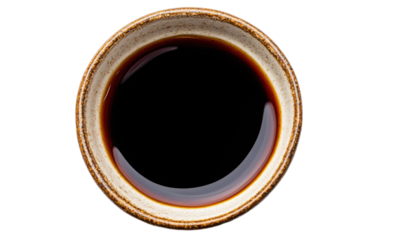 Bowl of coffee with a brown liquid in it