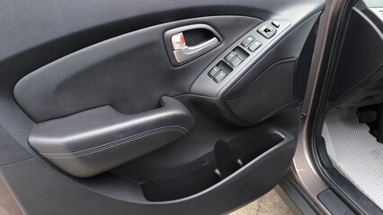 open car doors with window opening and locking control buttons