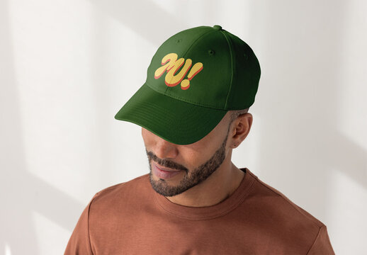 A man in a  cap looks downward. PSD template mockup