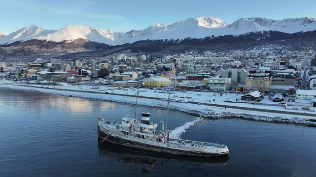 Saint Christopher Boat In Ushuaia Tierra Del Fuego Argentina. Bustling Downtown Cityscape With Modern Buildings. Outdoor Travel Destinations Patagonia Glacier. Snow Covered Aerial View.