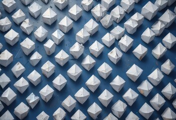 Textured blue backdrop with overlapping white diamond & square shapes in a geometric pattern , shapes, overlap