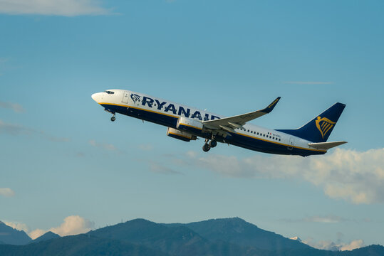 Bergamo, Italy - 05092024: Ryanair Boeing 737 taking off from the runway at Bergamo Orio al Serio Airport (BGY). Energetic departure of a popular low-cost flight with a mountain landscape backdrop