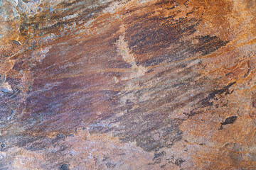 Naklejka premium Close-up of weathered rock surface with layers.