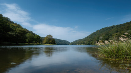 serene lake nestled among majestic mountains of kentucky reflecting clear blue sky and surrounded by lush greenery
