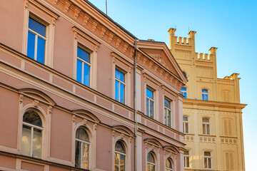 Architectural contrast of historic buildings against blue sky