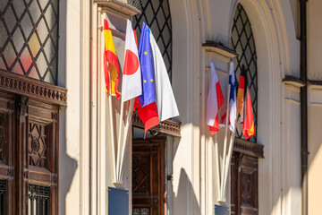 Display of international flags outside building representing global unity and culture