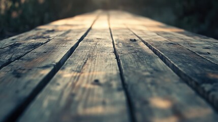 Obraz premium Close-up View of Weathered Wooden Plank Pathway in Nature Light