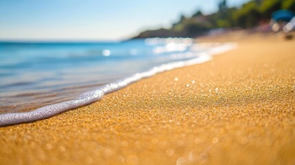Soft Ocean Waves Gently Caressing Golden Sand on Sunny Beach