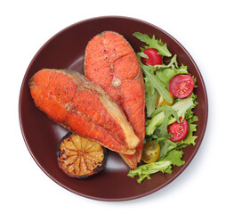 Seafood. Tasty salmon steaks, salad and lemon isolated on white, top view