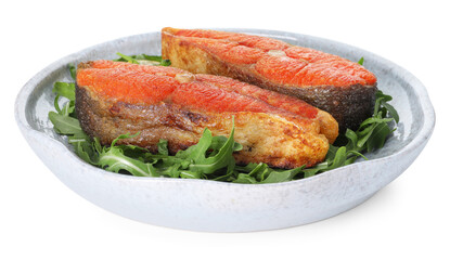 Seafood. Tasty salmon steaks and arugula isolated on white