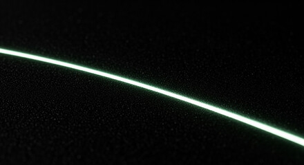 Bright curved glowing line illuminating dark textured background