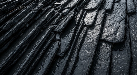 Dark layered rock formations with wet textured surface