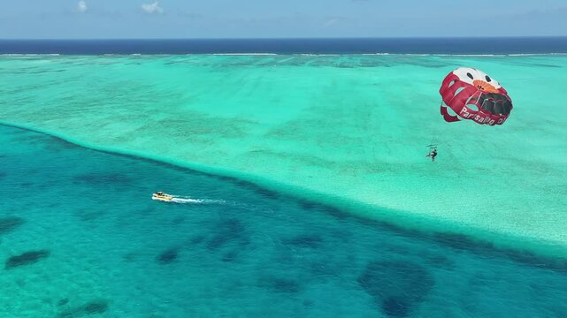 Parasail At San Andres Providencia Y Santa Catalina Colombia. Bird Eye View Of Stunning Parasailing Scene Over A Blue Ocean. Shore Clouds Sky Beach Sea. Shore Seaside Panoramic.