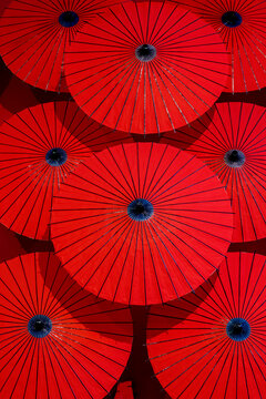 Red paper parasols on display, Arashiyama, Kyoto, Japan