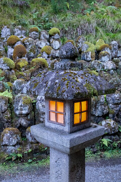 Stone Rakan statues and lantern, Otagi Nenbutsu-ji Temple, Arashiyama, Kyoto, Japan