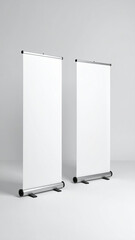 Two blank roll up banners displaying on gray background